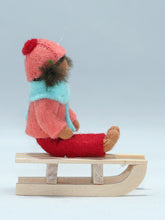 Kid Doll on Sleigh – 2.5" Handmade Felt Waldorf Doll by Ambrosius