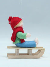 Kid Doll on Sleigh – 2.5" Handmade Felt Waldorf Doll by Ambrosius